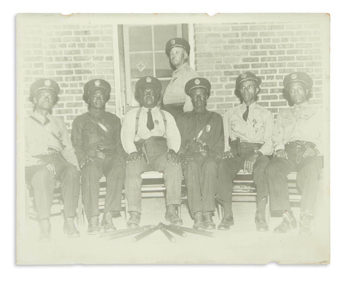 (LAW.) Group portrait of seven African-American policemen.